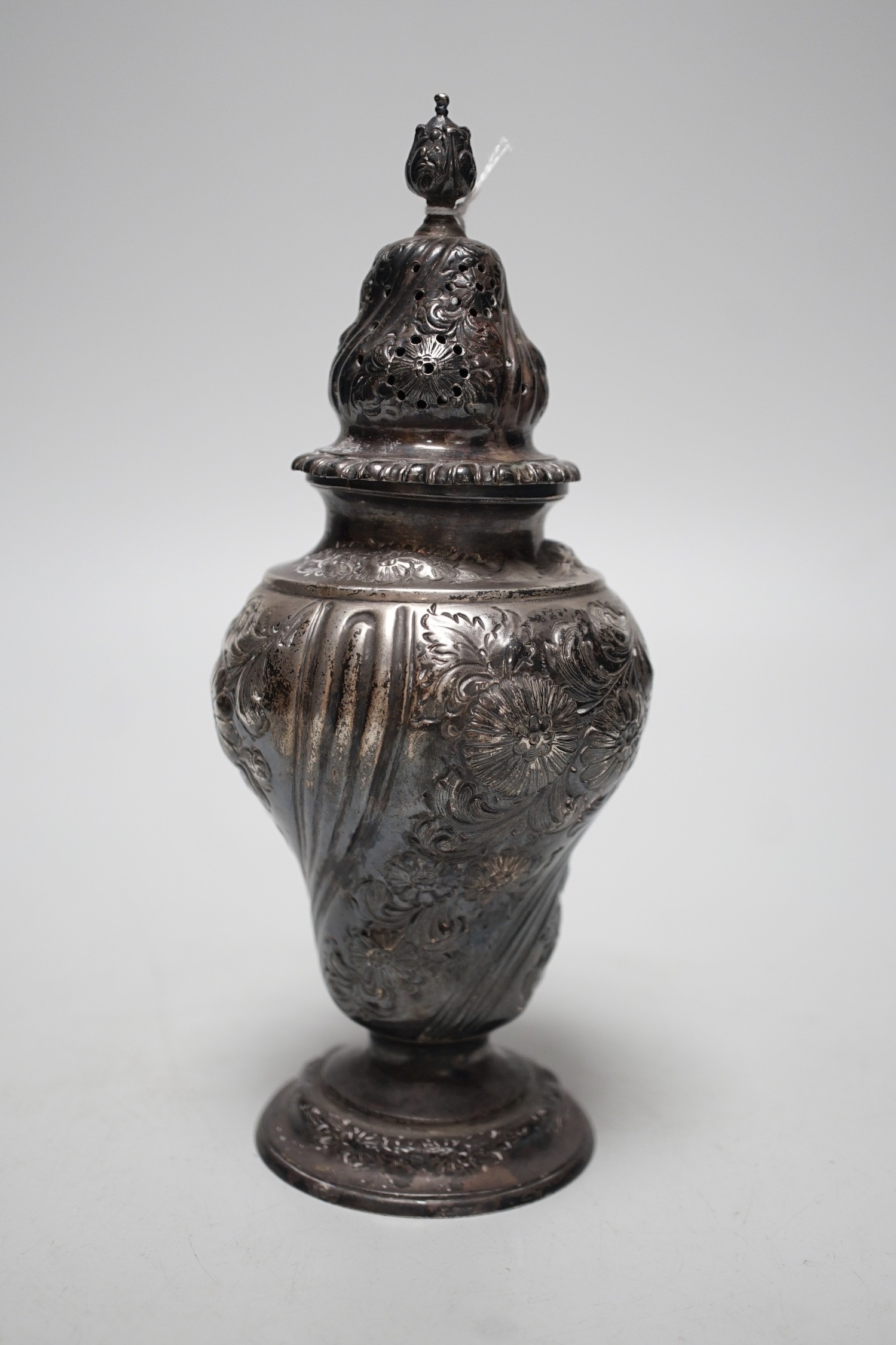 A late Victorian embossed silver inverted pear shaped sugar caster, Harris Brothers, London, 1897, 19.8cm, 7.5oz.